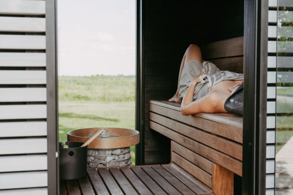 about-us Experience tranquility in a modern outdoor sauna with a serene view.